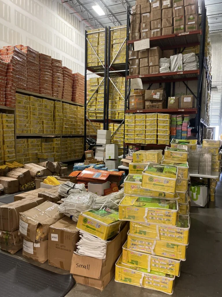 Warehouse storage area packed with stacked cardboard boxes
